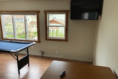 Carriage house living room with pool table